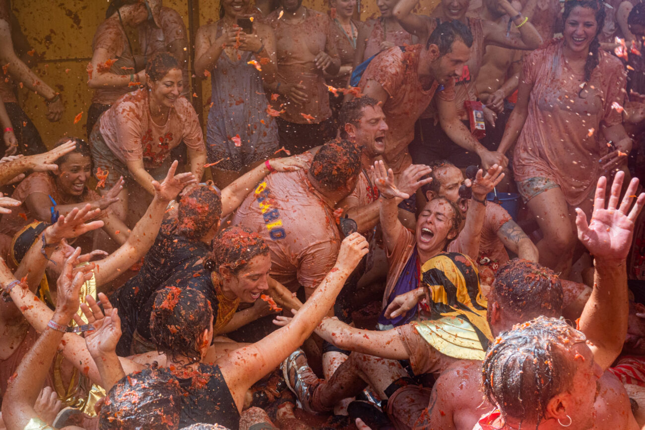 People throwing tomatoes during La Tomatina festival in Spain