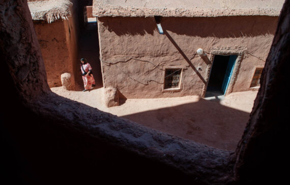 street photography morocco a woman walks in a village