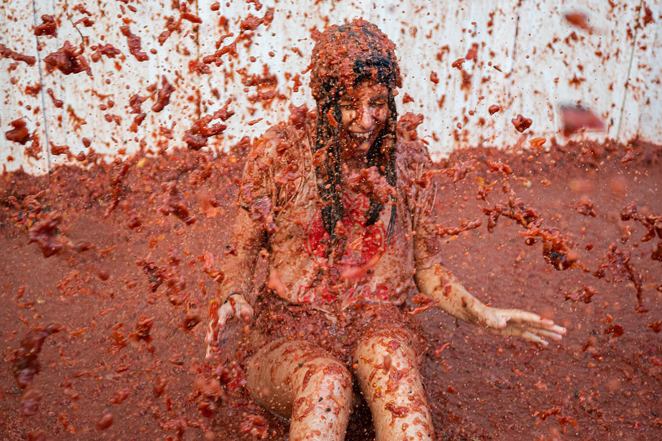 People throwing tomatoes during La Tomatina festival in Spain