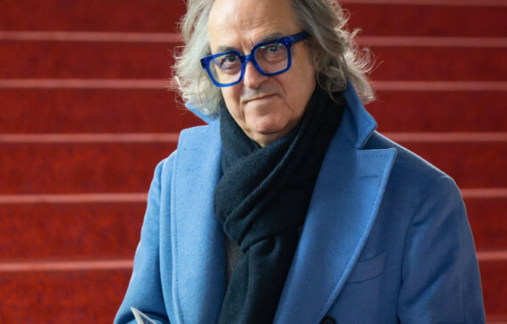 Luigi Marzullo posa per una fotografia all'interno del Teatro Regio di Torino