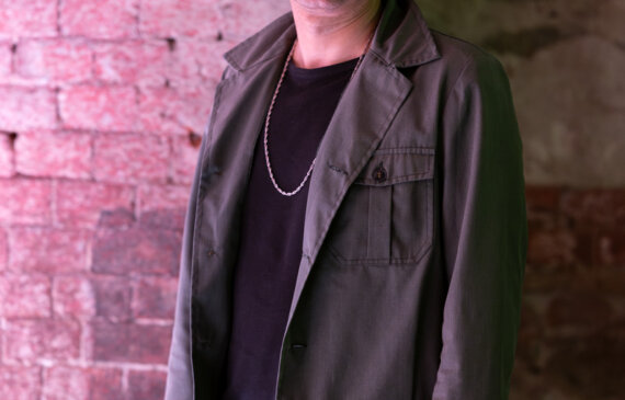 Il musicista di fama internazionale Gianluca Petrella ritratto a mezzo busto presso la location per eventi Ogr Torino