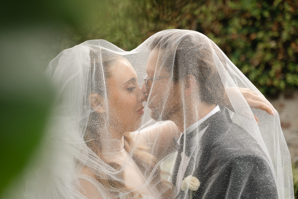 a bride and a groom spontaneously poses during their wedding at villa kimera, italy