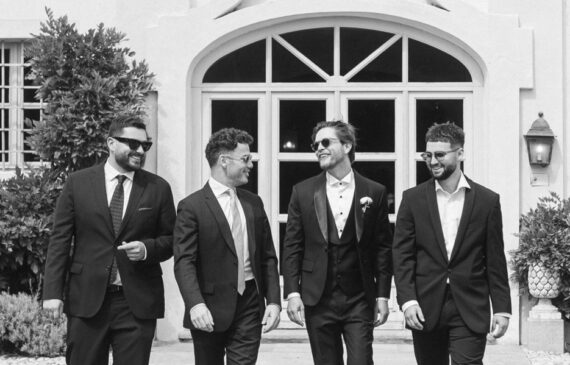 A groom and his batsman walks during a destination wedding in italy